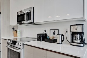 Apartamento superluxo, sacada, vista para a cidade | Cozinha privada