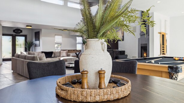 A modern living room with a pool table, comfortable seating, and a decorative plant centerpiece. - Scottsdale Luxury Villa w/ Pool, Hot Tub, Pickleball, Mini-Golf, Basketball (Scottsdale)