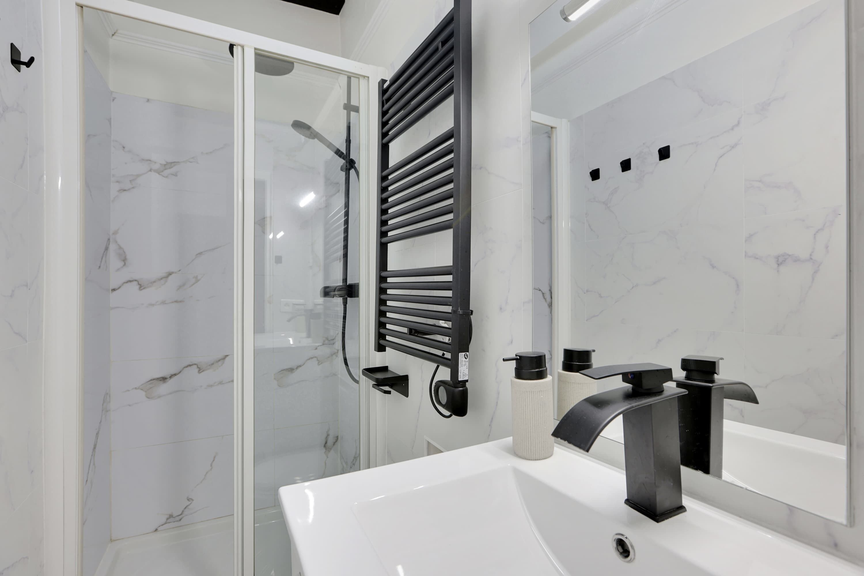 Shower, hair dryer, towels, shampoo