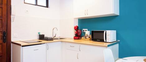 Microwave, stovetop, coffee/tea maker, toaster