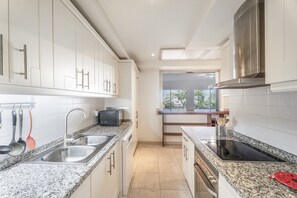 Fridge, microwave, oven, stovetop - Casa Micaela – Exclusive Home with Garden, Pools & Sea Views in Pueblo Don Thomas (Pueblo don Thomas)
