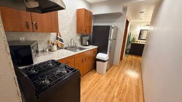 Fridge, microwave, oven, cookware/dishes/utensils