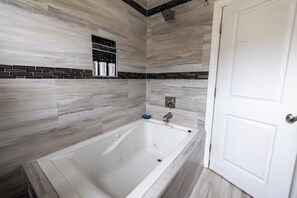 Shower, jetted tub, hair dryer, towels