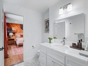 A modern bathroom with a large mirror, two sinks, and a vanity with drawers. - Luxury|Pool Table|Movie Room|Poker|Nature Oasis (Chagrin Falls)