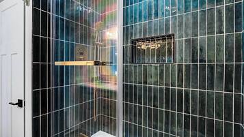 Shower, hair dryer, towels, shampoo