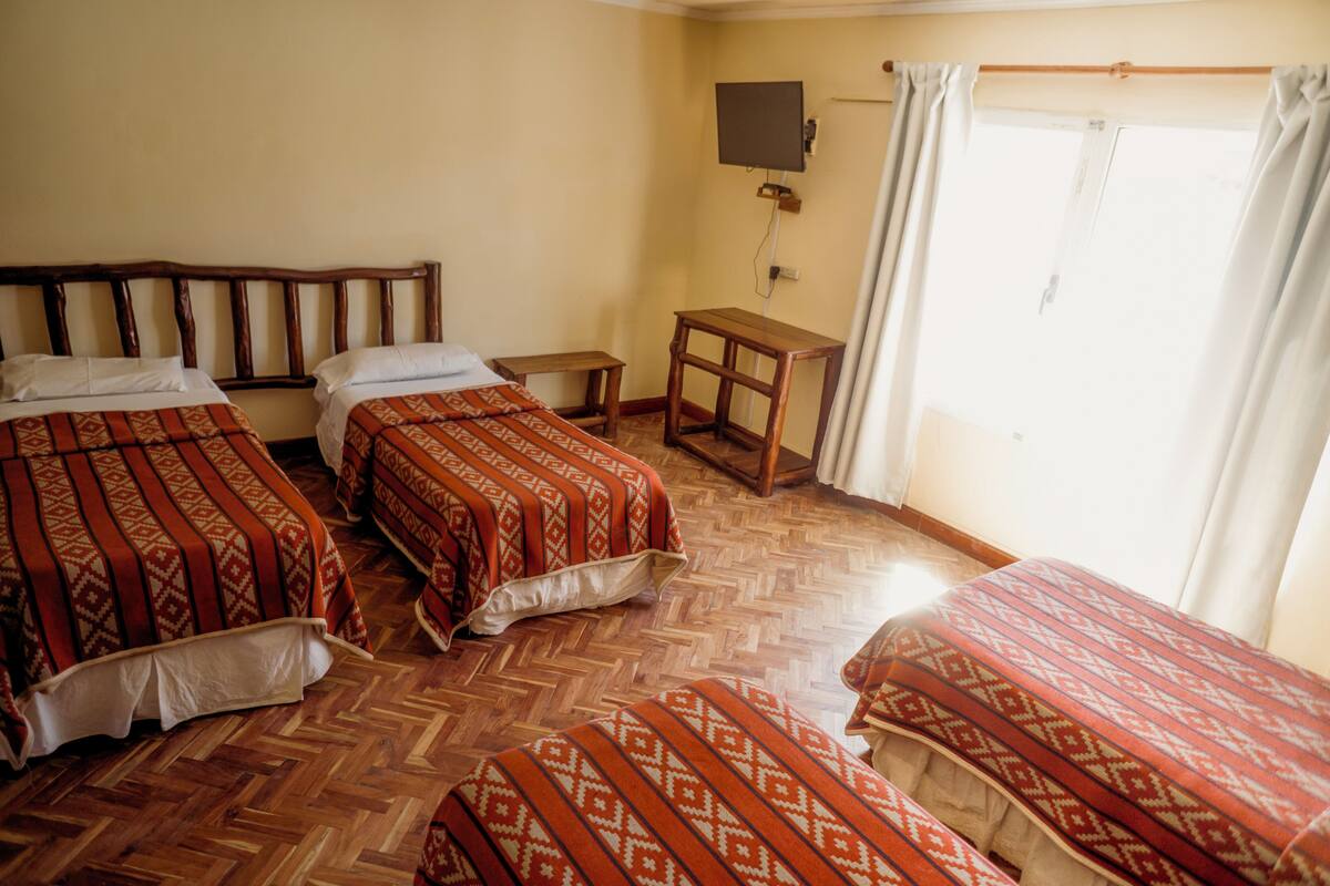Standard Quadruple Room, Garden View | Desk, laptop workspace, WiFi (free), bed sheets