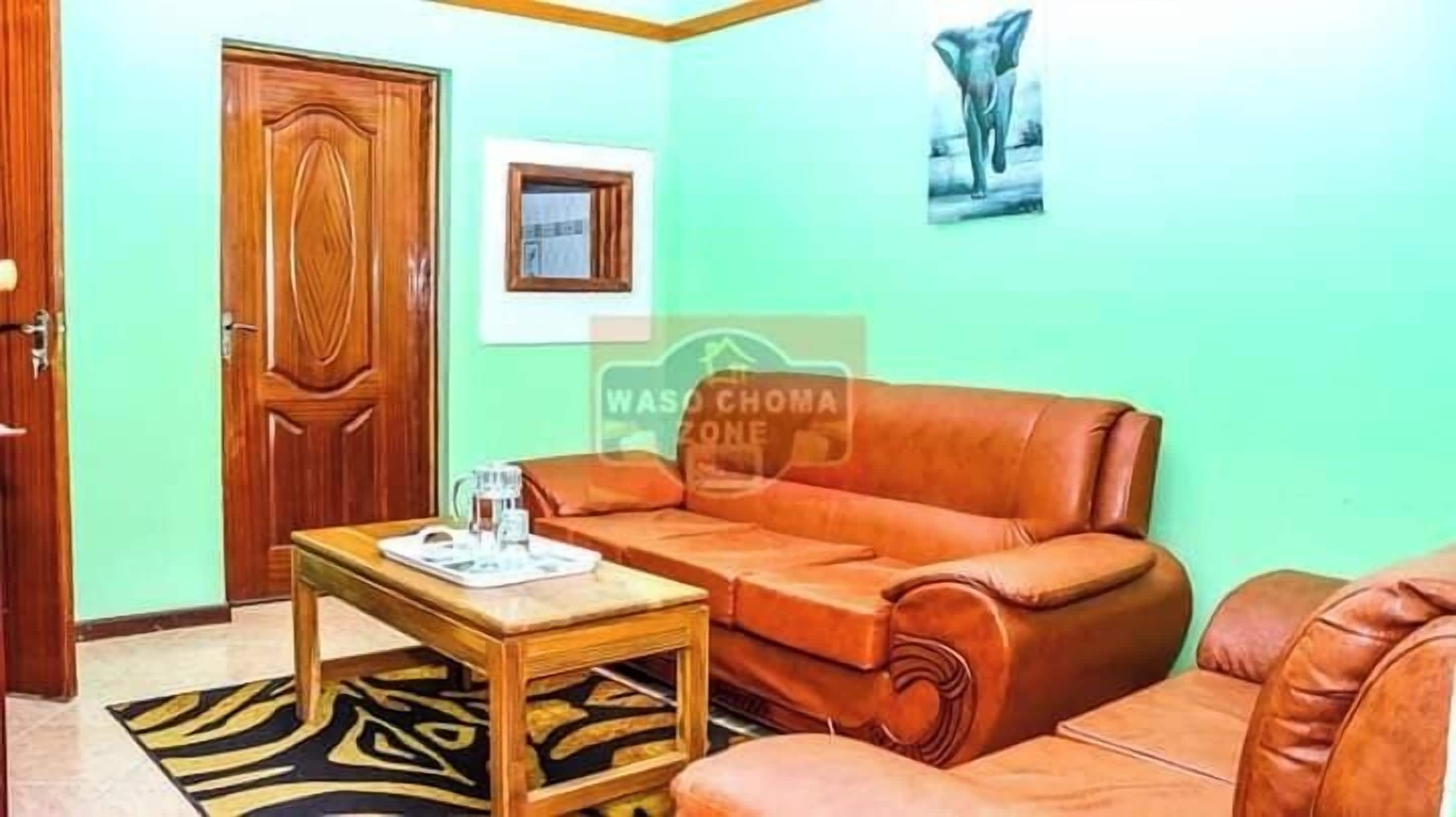 Deluxe Apartment | Living area | 32-inch Smart TV with digital channels