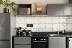 Fridge, microwave, oven, stovetop - Relaxed Coastal Stay | Braai and Balcony Views (Cape Town)