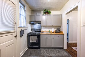 Fridge, microwave, oven, stovetop - Clintonville Gem • Fireplace • Modern Kitchen (Columbus)