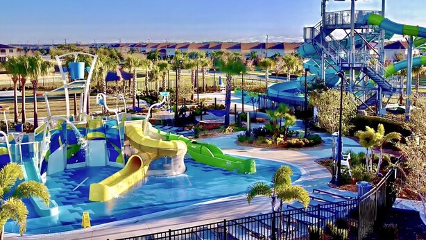 A water park with multiple slides and a covered area. - Disney Getaway! Luxury Townhouse with Private Pool. Book Now! #CG902 (Orlando)