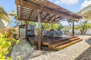 Outdoor dining - Colorful NSB Beach Retreat • Stunning Deck Oasis (New Smyrna Beach)