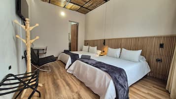 Comfort Quadruple Room | Premium bedding, down comforters, desk, laptop workspace