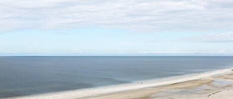 On the beach, sun loungers, beach towels