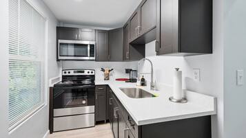 Fridge, microwave, stovetop, coffee/tea maker