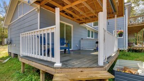 A two-story house with a wooden deck and a covered porch. - 10 Mi to Lake Conroe: Couple’s Retreat w/ Porch! (Montgomery)