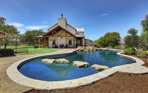 "A Luxurious Hilltop Haus Lifted by Grace Above the Texas Hills."