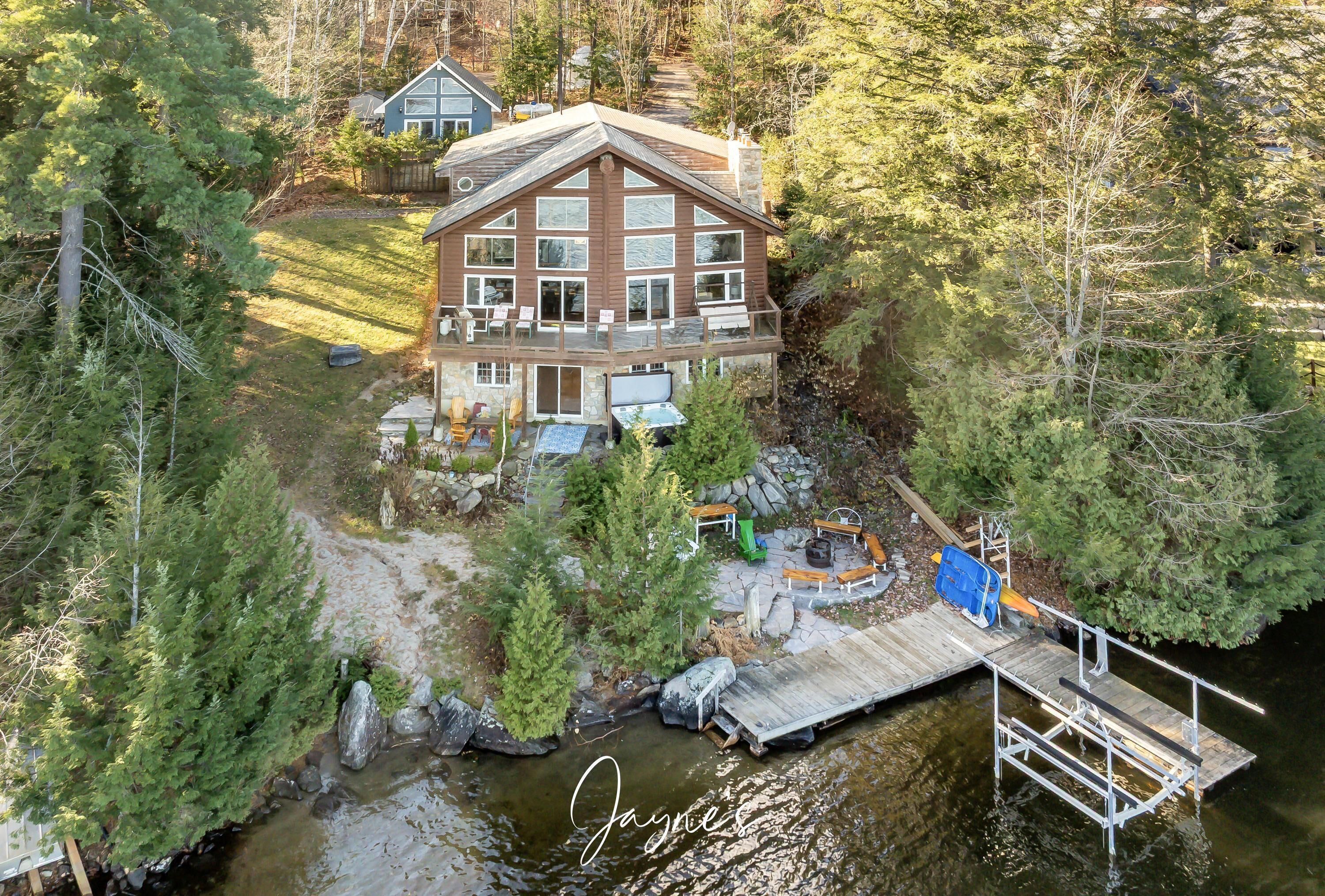 Secluded lakeside cabin with private dock and forest views