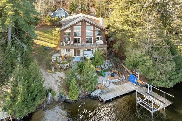 Secluded lakeside cabin with private dock and forest views