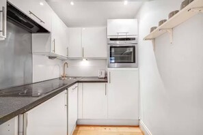 Dishwasher, coffee/tea maker, cookware/dishes/utensils, dining tables