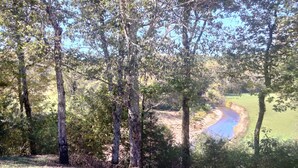 A natural landscape with trees, a river, and a grassy area. -  Beautiful piece of property in Westpoint. Great location for NATRA enthusiasts. (Westpoint)