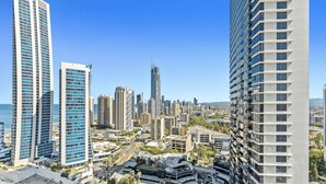 A high-rise urban area with modern architecture, including a distinctive curved building and several high-rise buildings with balconies. - Chevron Renaissance - 2 Bed 2 Bath - 3236 - 2 night - 2 bed 2 bath Apartment (SURFERS PARADISE)