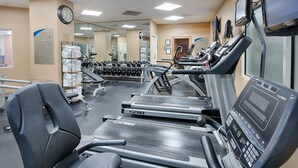 A gym with treadmills, weights, and a mirrored wall. - Waterfront 2BR Wyndham Villa – Steps to Dining, Shops, Capital Wheel & DC Access (Oxon Hill)