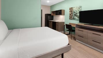 Suite, 1 cama Queen size, para no fumadores | Escritorio, espacio para trabajar con laptop y cortinas blackout