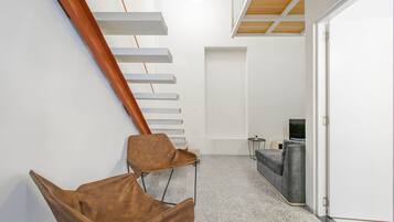 Deluxe Apartment | Living area | 30-inch flat-screen TV with cable channels