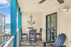 Outdoor dining - Beachfront Getaway! Pool, Balcony & Family Loft (Gulf Shores)