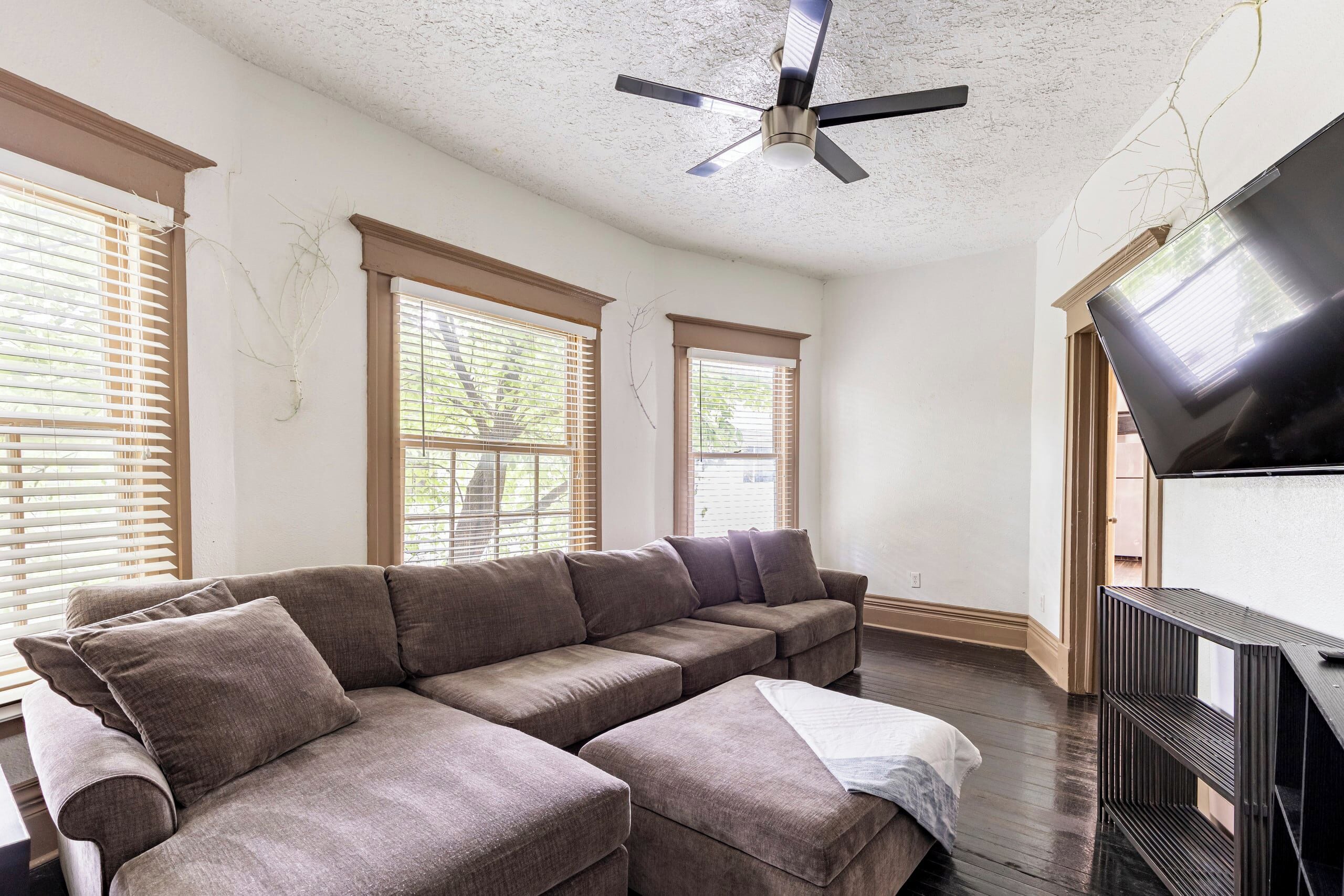Spacious living area with a large sectional sleeper sofa and plenty of seating. 