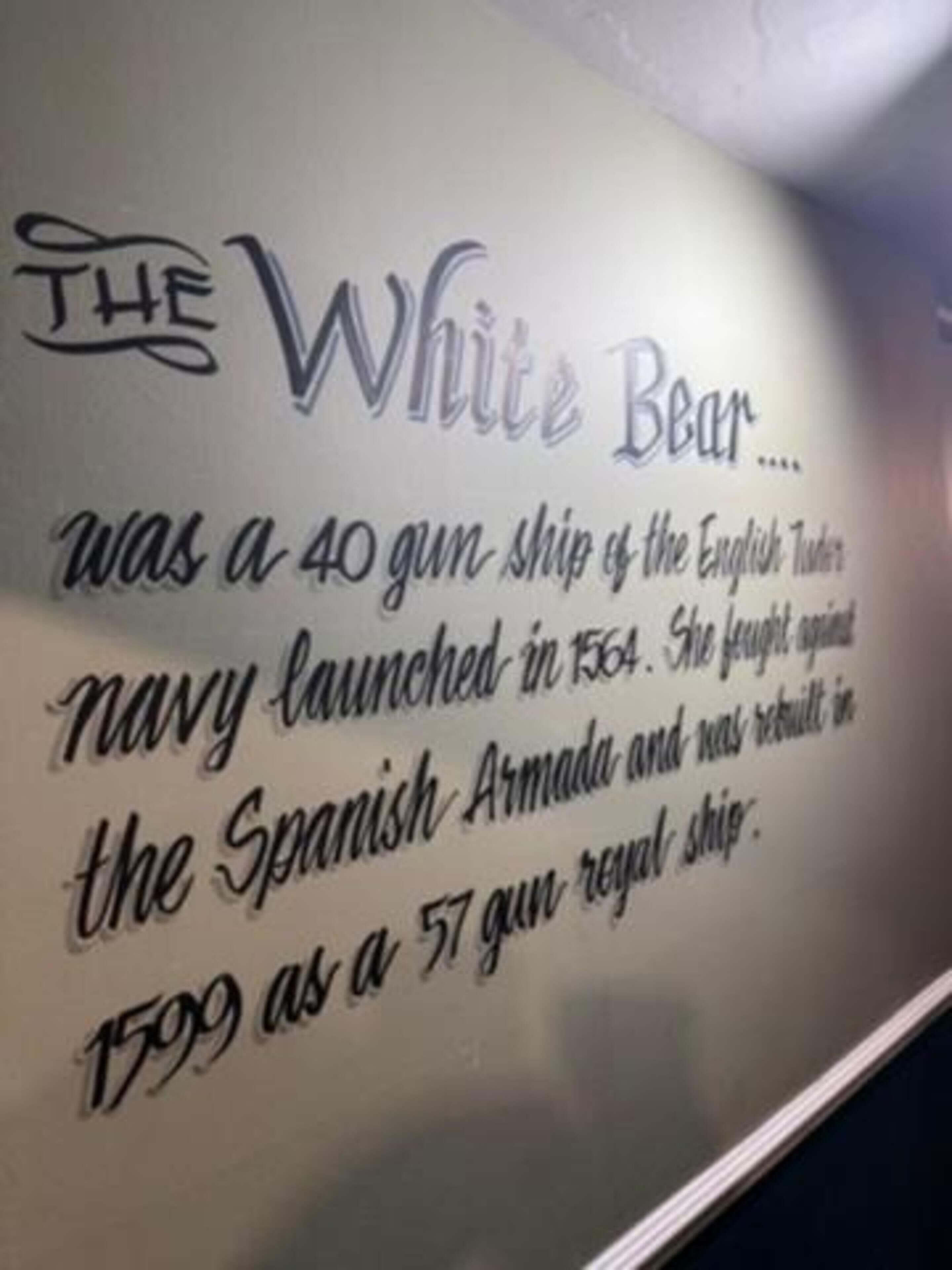 A wall with historical information about the White Bear, a 40-gun ship of the English Navy launched in 1564, which fought against the Spanish Armada and was later a 57-gun royal ship.