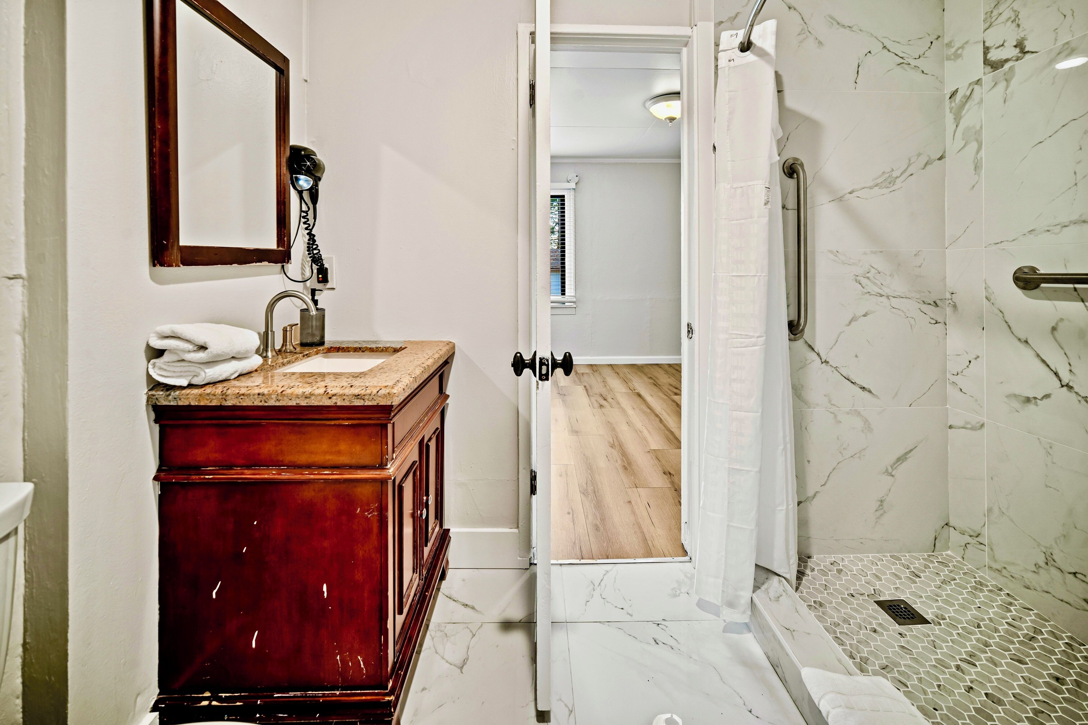 Shower, hair dryer, towels