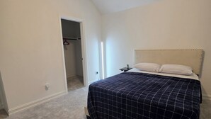 A bedroom with a bed, a closet, and a door leading to another room. -  2 private rooms upstairs in a 4-bedroom house with AC. its not for entire house (Fort Worth)