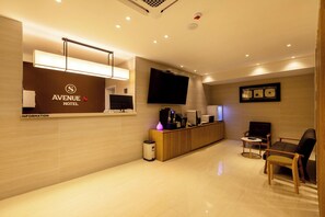 Chambre Double Deluxe, vue ville | Coin séjour