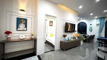 Comfort Villa, 4 Bedrooms, Air conditioning, Beach View | Living area | 32-inch flat-screen TV with cable channels