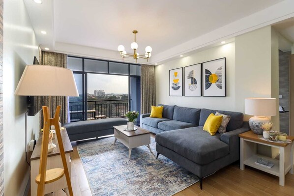 Classic Apartment, Balcony, City View | Living area | 55-inch Smart TV with cable channels, Netflix, first-run movies