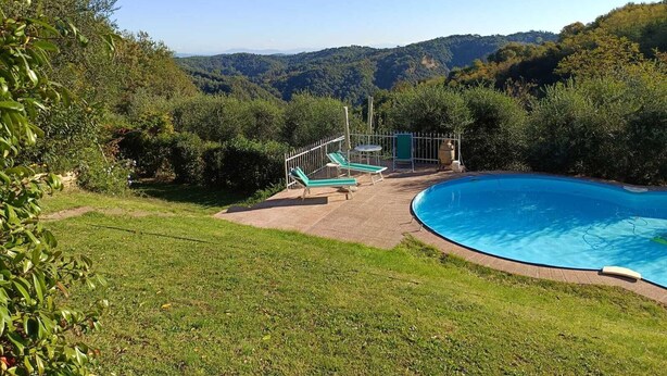 A swimming pool with a view of a mountainous landscape. - BELVEDERE HOUSE with fenced garden and private pool in panoramic location (Palaia)