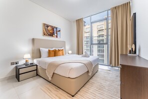 2 chambres, coffres-forts dans les chambres, fer et planche à repasser