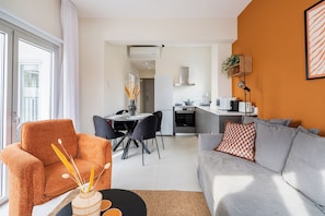 202 - 2BR City view & Balcony | Living room | 43-inch Smart TV with digital channels, streaming services - Local Host Living - Signature Apartments in Nicosia (Nicosia)