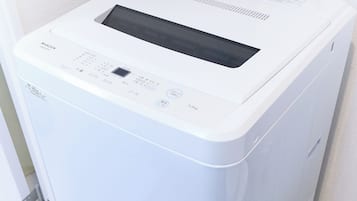 Combined shower/tub, free toiletries, hair dryer, slippers