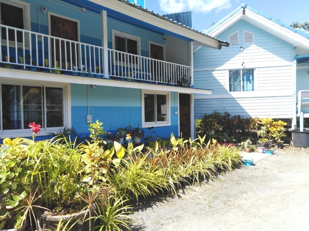 A two-story building with a balcony on the upper floor.