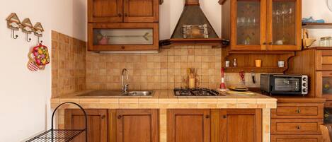 Fridge, stovetop, coffee/tea maker, dining tables