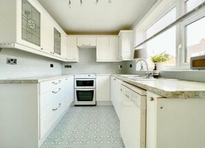 Fridge, dishwasher, toaster, cookware/dishes/utensils