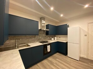 Fridge, oven, toaster, cookware/dishes/utensils