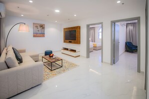 In-room safe, desk, laptop workspace, blackout curtains - Neema Hotel Apartment  (Al Wajh)