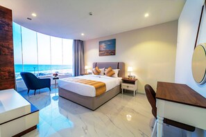 In-room safe, desk, laptop workspace, blackout curtains - Neema Hotel Apartment  (Al Wajh)