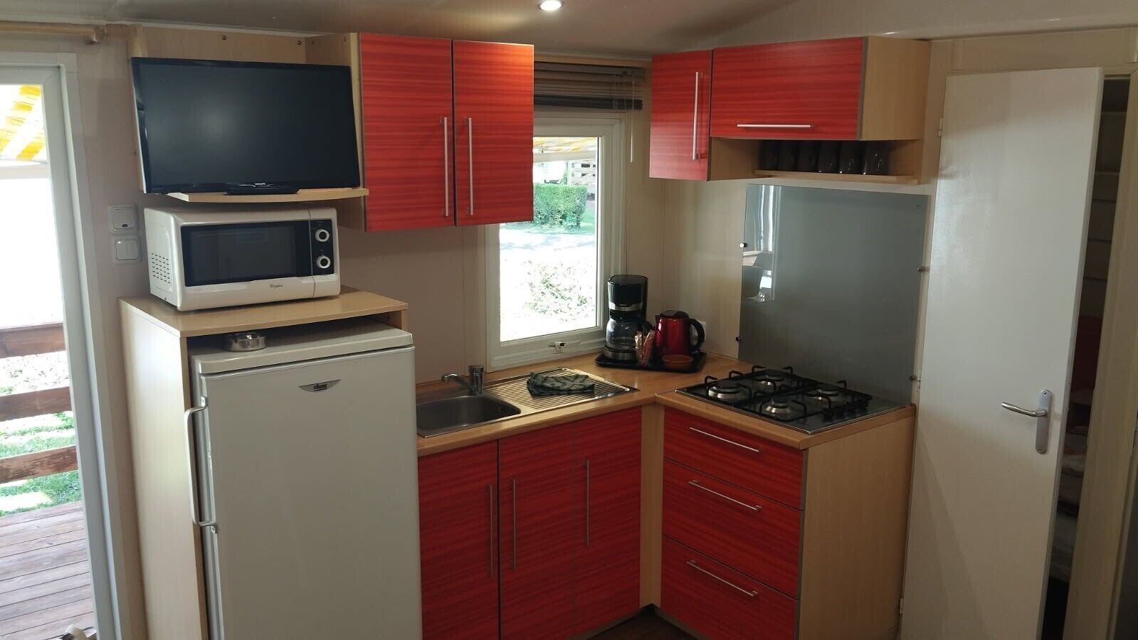 Fridge, microwave, stovetop, coffee/tea maker