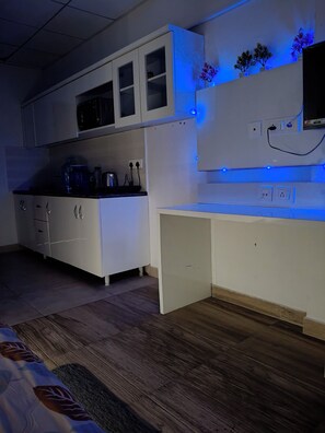 Luxury Studio Suite, City View | Private kitchen | Full-size fridge, microwave, oven, stovetop