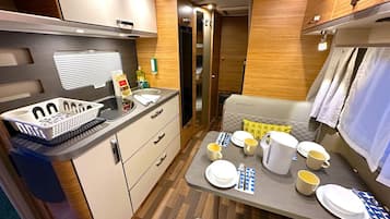 Fridge, stovetop, coffee/tea maker, electric kettle