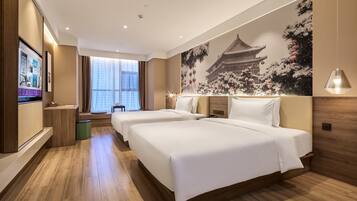 Premium bedding, down duvets, free minibar, blackout curtains